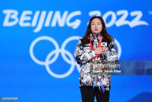 Gold medallist Minjeong Choi of Team South Korea looks on from the podium during the Women's 1500m medal ceremony on Day 13 of the Beijing 2022...