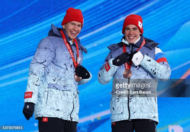 Bronze medallists Alexander Bolshunov and Alexander Terentev of Team ROC pose with their medals during the Men's Team Sprint Classic medal ceremony...