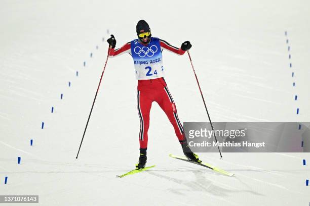 Joergen Graabak of Team Norway celebrates after winning the Gold medal during the Large Hill/4x5km, Cross-Country Round as part of Biathlon Team...