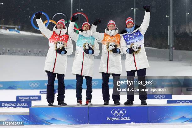 Gold medal winners; Espen Bjoernstad, Espen Andersen, Jens Luraas Oftebro and Joergen Graabak of Team Norway celebrate on the podium during the...