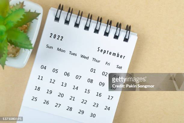 top views calendar desk september is the month for organizers to plan and remind on brown paper backgrounds in their home offices. business planning appointment meeting concept - september fotografías e imágenes de stock