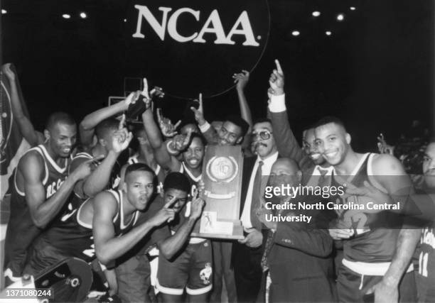 Coach Michael Bernard poses with the victorious 1989 NCAA Championship Team.