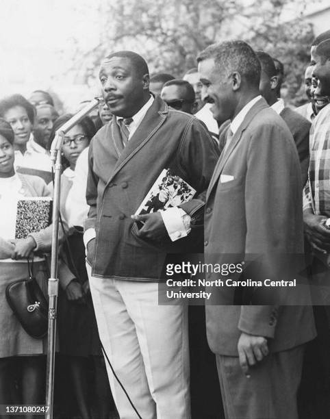 Dick Gregory with College President Samuel Massie during a CORE Benefit concert at North Carolina Central University on September 23, 1964 in Durham,...