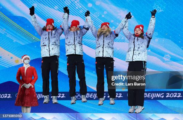 Silver Medallists Irina Kazakevich, Kristina Reztsova, Svetlana Mironova and Uliana Nigmatullina of Team ROC celebrate during the Women's Biathlon...