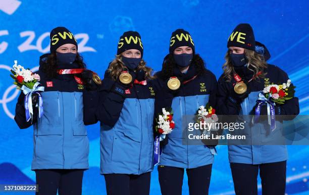 Gold medallists Linn Persson, Mona Brorsson, Hanna Oeberg and Elvira Oeberg of Team Sweden pose with their medals during the Women's Biathlon 4x6km...