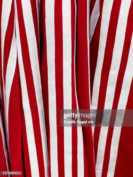 striped red sportswear - vertical lines stock pictures, royalty-free photos & images