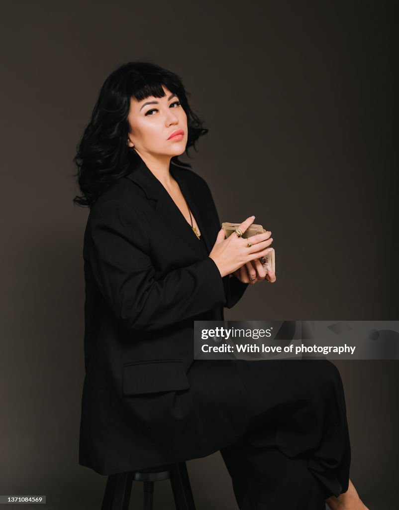 Woman fortune-teller making predictions, astrologist, tarot cards in hands