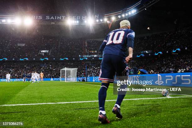 Neymar of Paris Saint-Germain takes a corner kick in the UEFA Champions League Round Of Sixteen Leg One match between Paris Saint-Germain and Real...