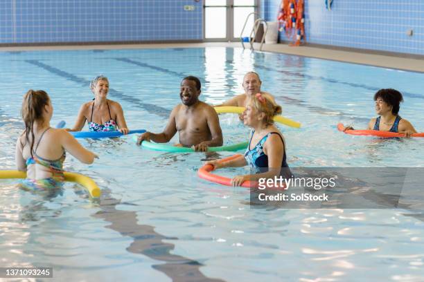 fun during swim class - swimming lanes stock pictures, royalty-free photos & images
