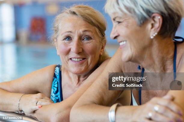 happy and young at heart - swimming pool fun stock pictures, royalty-free photos & images