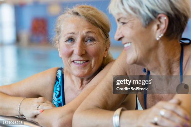happy and young at heart - old woman blue eyes close up stock pictures, royalty-free photos & images