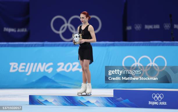 Silver Medallist Alexandra Trusova of Team ROC poses during the Women Single Skating Free Skating flower ceremony on day thirteen of the Beijing 2022...