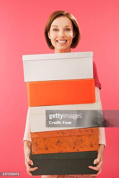 woman holding shoes - shoe box stock pictures, royalty-free photos & images