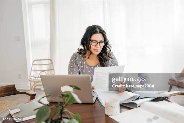 income tax preparation - personal tax advisor working from home - sales tax stock pictures, royalty-free photos & images
