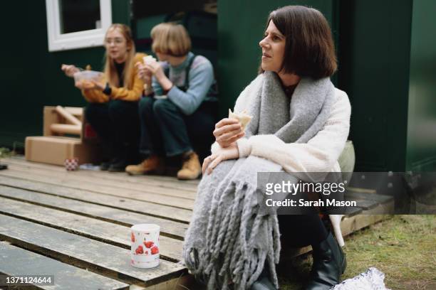 three colleagues sat outside on lunchbreak - white shawl stock pictures, royalty-free photos & images