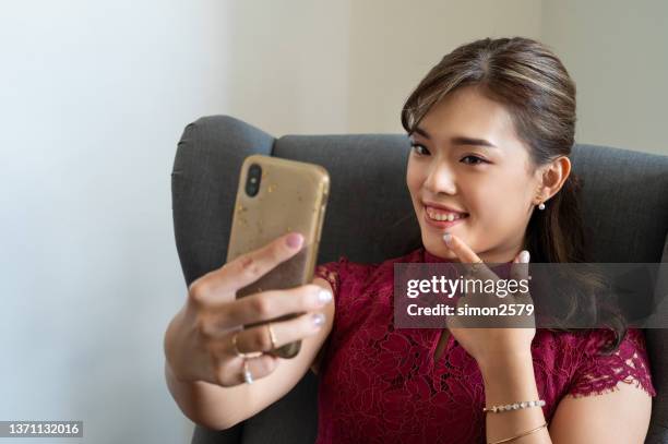 beautiful asian business woman using smartphone while working at office - skin diamond stock pictures, royalty-free photos & images