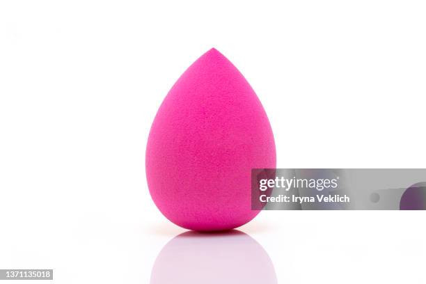 concept the beauty product foundation pink purple colored sponge in shape of easter egg on white color background, isolated. easter and beauty minimal concept. - licuadora fotografías e imágenes de stock