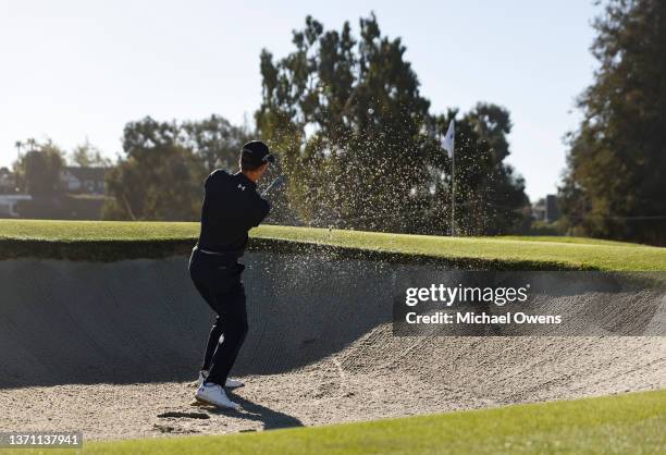 Maverick McNealy of the United States plays a shot from a bunker on the third hole during the first round of The Genesis Invitational at Riviera...