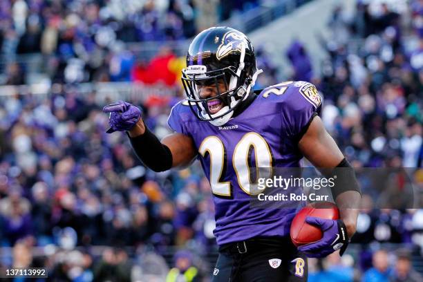 Ed Reed of the Baltimore Ravens celebrates his interception against Andre Johnson of the Houston Texans during the fourth quarter of the AFC...