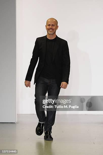 Designer Italo Zucchelli acknowledge the applause of the public after the Calvin Klein Collection fashion show as part of Milan Fashion Week Menswear...