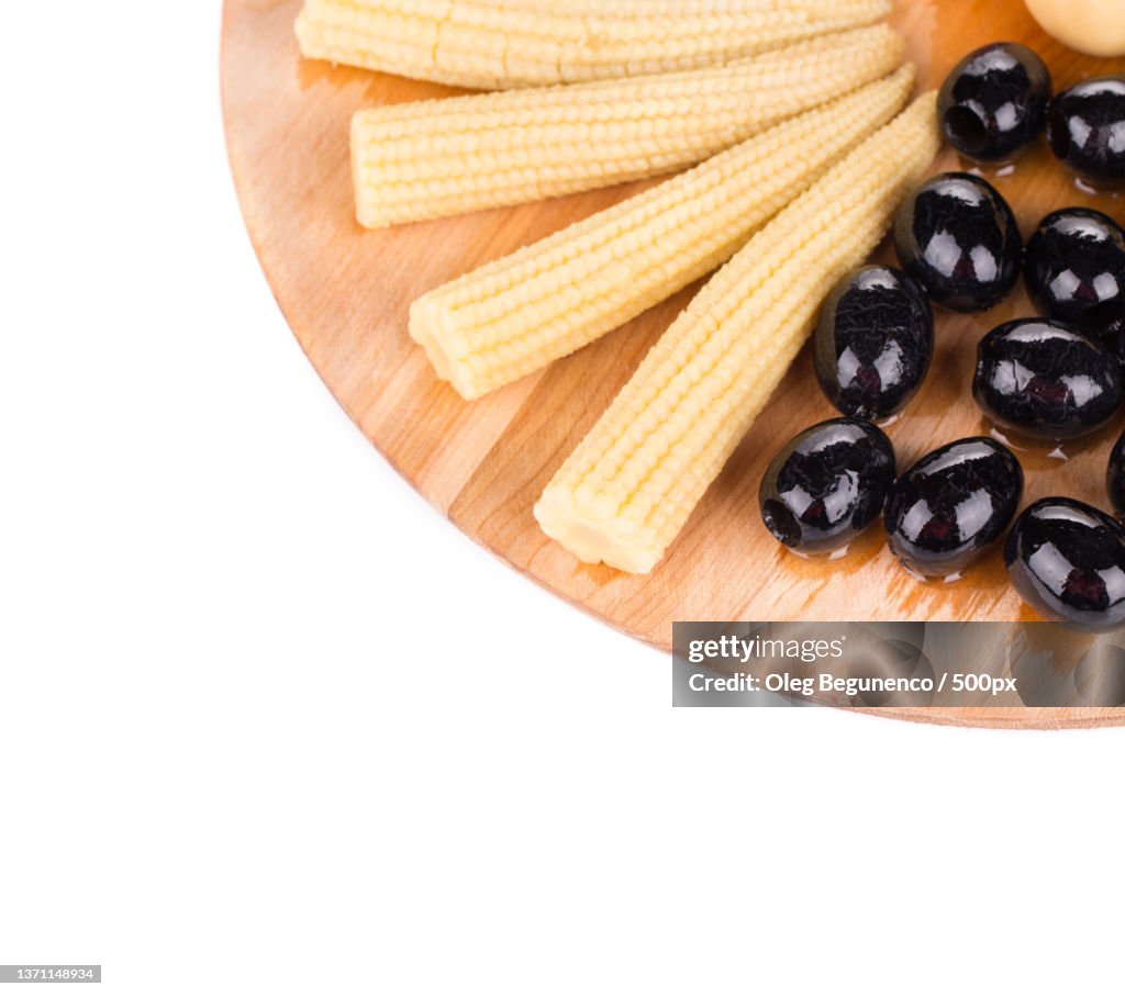 Baby corn and olives on platter,Moldova