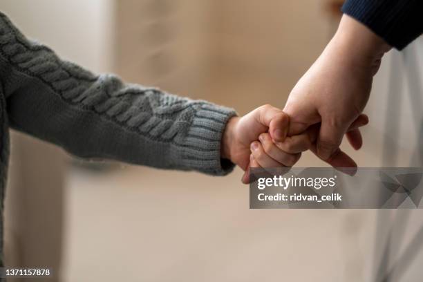 hold on tight and never let go - adult stockfoto's en -beelden