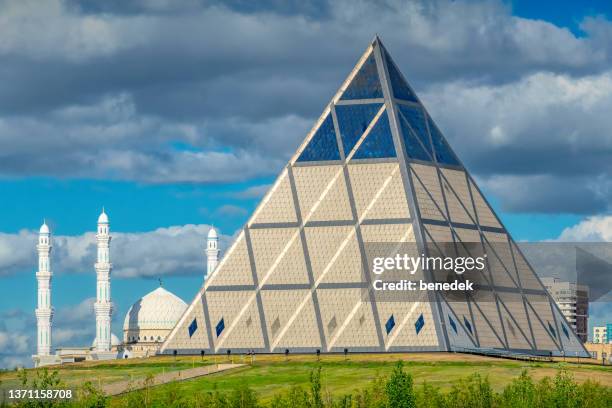 nur-sultan kazakhstan palace of peace and reconciliation pyramid - astana kazakhstan stock pictures, royalty-free photos & images