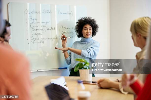 female project manager making presentation to team - business strategy whiteboard stock pictures, royalty-free photos & images