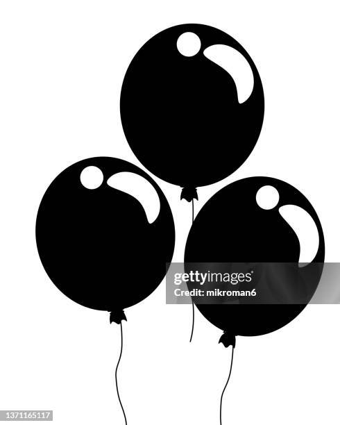 illustration of balloons helping to celebrate some special occasion. - black balloon stock-fotos und bilder