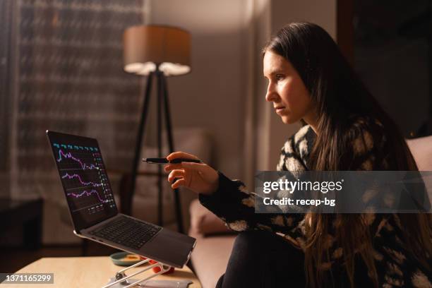 woman checking chart for currency information on laptop. cryptocurrency concept - gesture control screen imagens e fotografias de stock