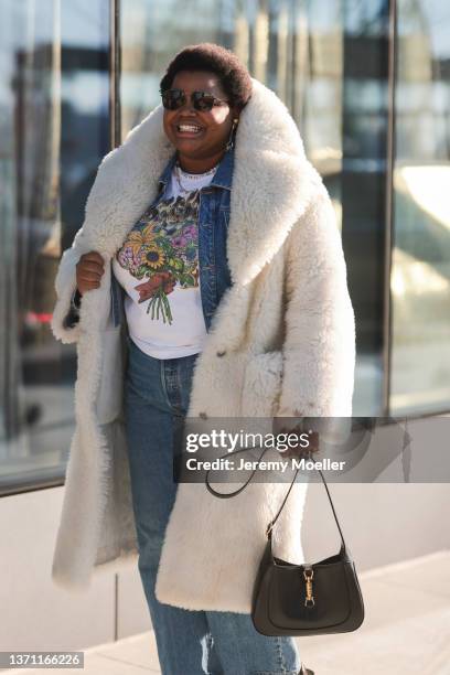 Gabriella Karefa-Johnson is seen wearing denim jacket, jeans, white teddy coat with high collar, outside Peter Do during New Yorker Fashion Week on...