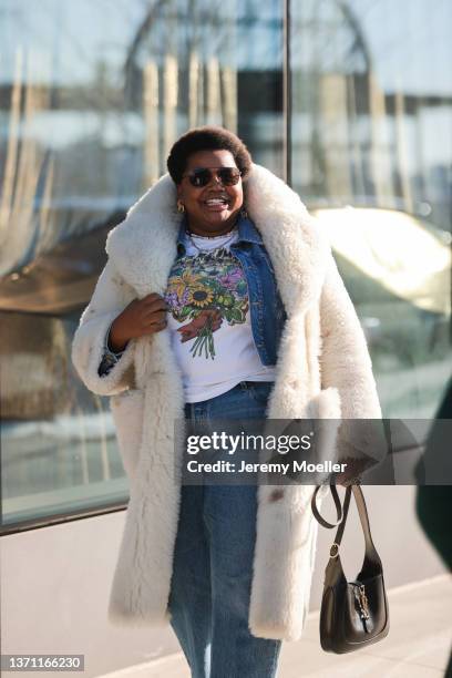 Gabriella Karefa-Johnson is seen wearing denim jacket, jeans, white teddy coat with high collar, outside Peter Do during New Yorker Fashion Week on...