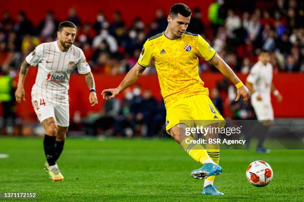 Amer Gojak of GNK Dinamo Zagreb passes the ball during the Knockout Round Play-Offs Leg One - UEFA Europa League match between Sevilla FC and Dinamo...