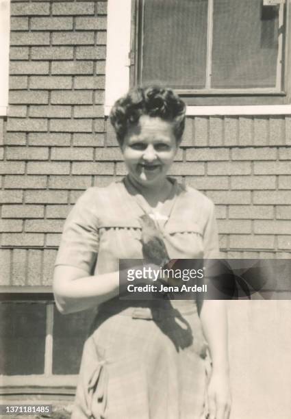 vintage woman holding bird, happy vintage woman smiling, vintage family photo - 1930s era stock pictures, royalty-free photos & images