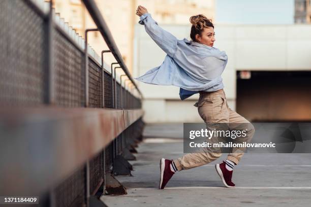 young woman dancing - breakdancing stock pictures, royalty-free photos & images