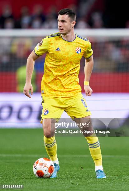 Amer Gojak of Dinamo Zagreb controls the ball during the UEFA Europa League Knockout Round Play-Offs Leg One match between Sevilla FC and Dinamo...