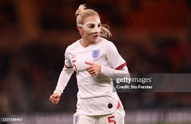 England player Alex Greenwood in action wearing a protective face mask during the Arnold Clark Cup match between England Lionesses and Canada at...