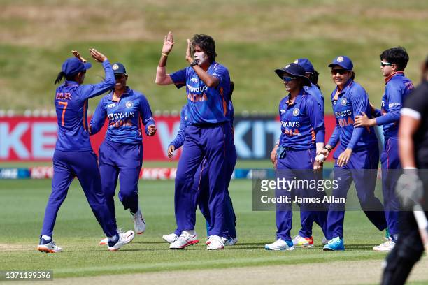 Indian players celebrate the wicket of White Fern Sophie Devine during game three in the One Day International series between the New Zealand White...