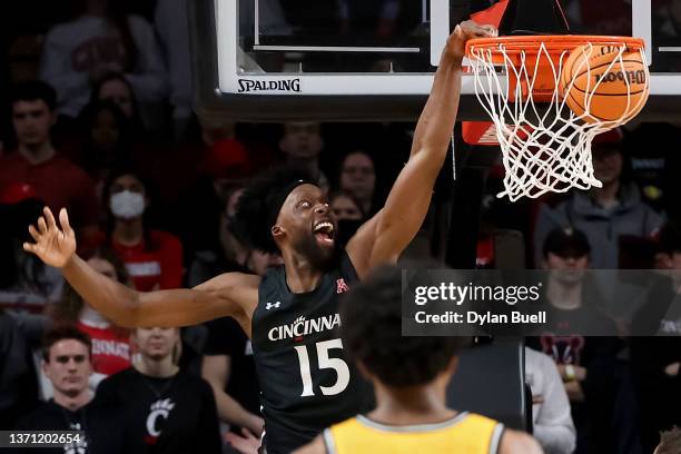 John Newman III of the Cincinnati Bearcats dunks the ball in the second half against the Wichita State Shockers at Fifth Third Arena on February 17,...