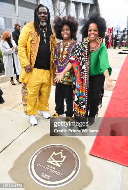 Rodney Kendrick, Raif-Henok Emmanuel Kendrick, and Rhonda Ross attend The Crown Jewel of Excellence Induction Ceremony at Mercedes Benz Stadium on...