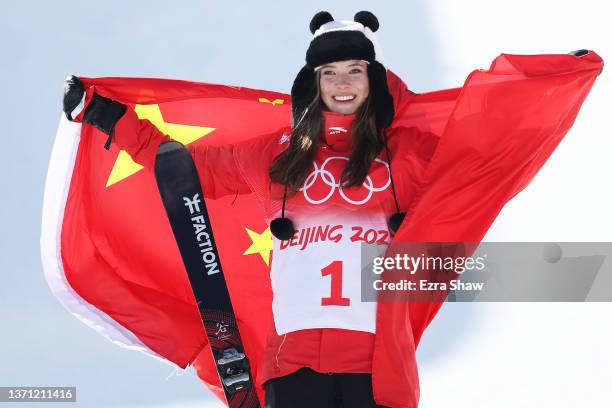 Gold medallist Ailing Eileen Gu of Team China poses during the Women's Freeski Halfpipe flower ceremony on Day 14 of the Beijing 2022 Winter Olympics...