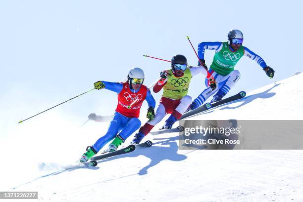 Simone Deromedis of Team Italy, Adam Kappacher of Team Austria and Bastien Midol of Team France compete during the Men's Ski Cross 1/8 Finals on Day...