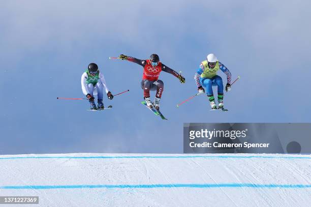 David Mobaerg of Team Sweden, Brady Leman of Team Canada and Sergey Ridzik of Team ROC compete during the Men's Ski Cross 1/8 Finals on Day 14 of the...
