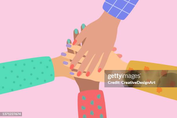 ilustraciones, imágenes clip art, dibujos animados e iconos de stock de grupo diverso de mujeres juntando sus manos. comunidad de equipo, unidad, asociación, cooperación y concepto de unión. - hands clasped