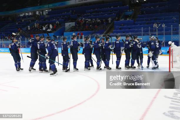 Team Finland celebrate their 2-0 win over Team Slovakia during the Men's Ice Hockey Playoff Semifinal match between Team Finland and Team Slovakia on...