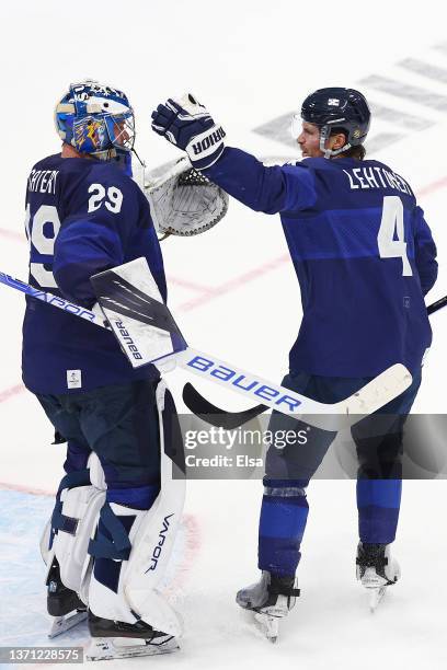 Harri Sateri and Mikko Lehtonen of Team Finland celebrate their 2-0 win over Team Slovakia during the Men's Ice Hockey Playoff Semifinal match...