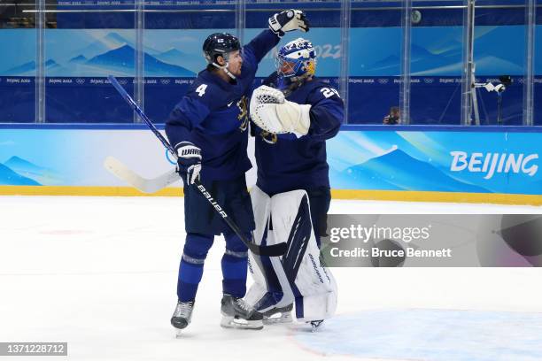 Mikko Lehtonen and Harri Sateri of Team Finland celebrate their 2-0 win in the Men's Ice Hockey Playoff Semifinal match between Team Finland and Team...