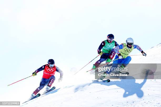 Sergey Ridzik of Team ROC, Reece Howden and Brady Leman of Team Canada compete during the Men's Ski Cross Quarterfinals on Day 14 of the Beijing 2022...