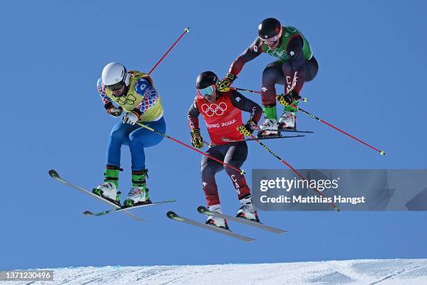 Sergey Ridzik of Team ROC, Brady Leman of Team Canada and Reece Howden of Team Canada compete during the Men's Ski Cross Quarterfinals on Day 14 of...