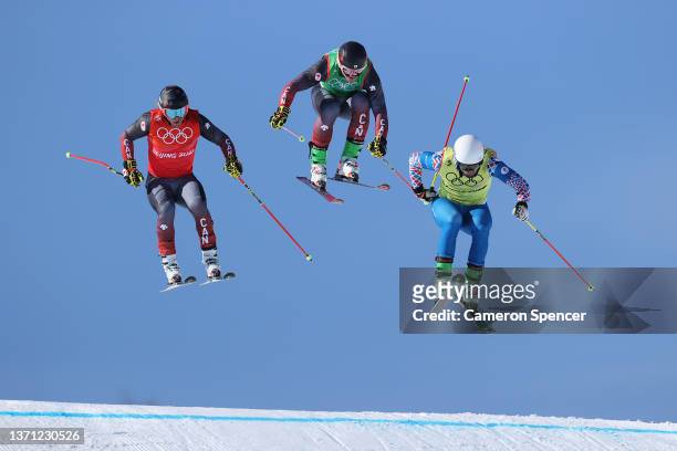 Brady Leman of Team Canada, Reece Howden of Team Canada and Sergey Ridzik of Team ROC compete during the Men's Ski Cross Quarterfinals on Day 14 of...